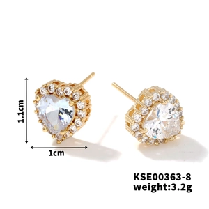 Detailed view of gold heart stud earrings with cubic zirconia and exact size dimensions