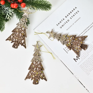Three glittery gold gradient metal Christmas tree ornaments with festive pine decor