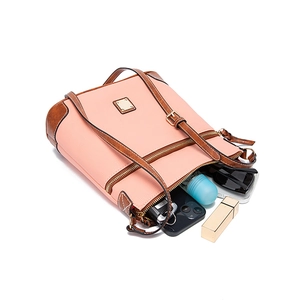 Interior view of pebble leather crossbody bag showing storage for phone, keys and lipstick