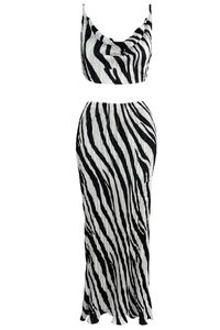 Detail of black and white zebra print plissé fabric with a draped neckline design