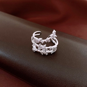 Macro view of a multi-layer silver open ring with marquise and round cubic zirconia stones
