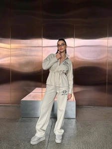 Beige two-piece cotton tracksuit set with drawstring zip jacket and straight-leg pants