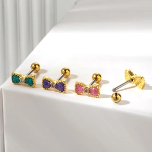 Sparkly bow knot stud earrings set in gold with pink purple and green glitter finish