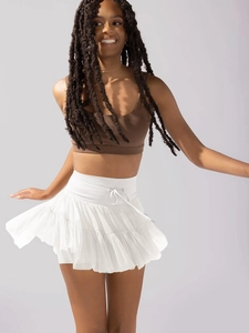 Detail of high waisted white pleated skirt with drawstring and sporty brown tank top