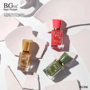 Flat lay of 14ml nail polish bottles in red, gold, and green on white stone pieces