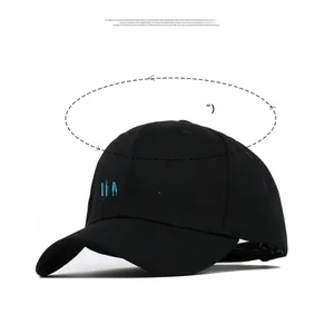 Close-up of MADE IN THE 90'S embroidery on a black cotton baseball cap detail