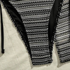 Close-up of striped crochet bikini bottom with side ties and detailed knit texture