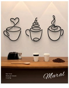 Detailed view of three minimalist coffee wall murals on a warm restaurant background
