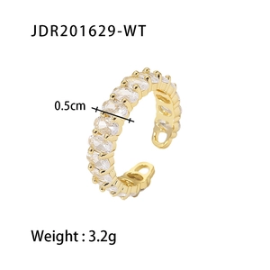 Close-up of gold ring with oval zircon inlay, 0.5cm width and adjustable band detail