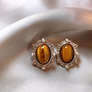 Vintage oval tiger eye stone earrings with silver frames and small white pearls
