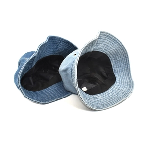 Classic washed denim bucket hats in dark and light blue colors on a white background