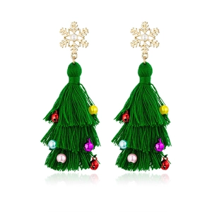 Detail of green tassel Christmas tree earrings with gold snowflakes and colorful beads