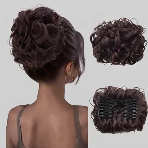 Detail of dark brown wavy synthetic hair bun extension with double-row claw clip attachment