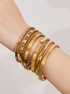 Détails de bracelets en acier doré sertis de zircons 5A avec design en nid d'abeille