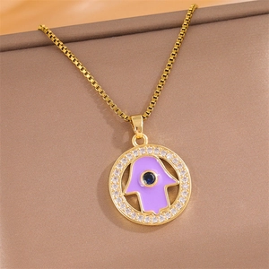 Gold Hamsa Hand necklace with purple enamel, sparkling zircons and a box chain