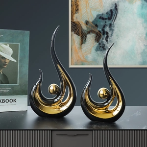 Modern abstract ceramic phoenix sculptures in black and gold for living room shelf decor