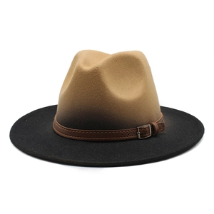 Close-up of dual-tone fedora hat with brown leather band and silver metal buckle