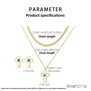 Detail view of gold stainless steel necklace and earrings set with evil eye cross pendant