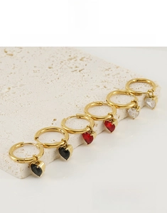 Detailed view of 18K gold plated heart earrings with black red and white zircons
