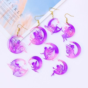 DIY moon fairy wing earrings made from resin silicone molds with glitter finish