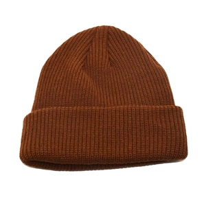 Thick ribbed knit beanie in caramel rust with cuffed hem for winter warmth protection