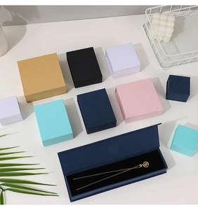 Minimalist magnetic flip-top jewelry boxes in various colors and sizes for rings and necklaces