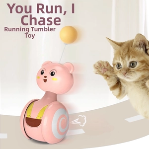 Pink bear tumbler cat toy with a yellow spring ball showing interactive movement