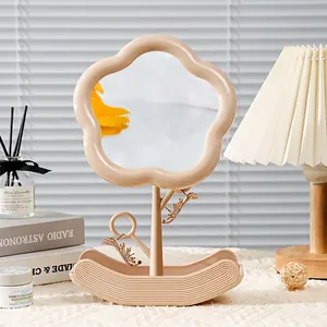Cloud shaped makeup mirror with adjustable beige flower frame and jewelry storage base