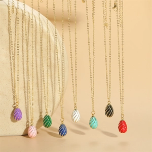 Colorful drop-shaped pendant necklaces with golden spiral wrap details and slim chains