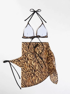 Flat lay of three-piece tiger print bikini set with matching mesh sarong cover-up