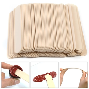 Macro view of smooth natural wood wax spatulas for beauty treatments and DIY use