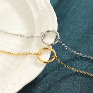 Minimalist 18K gold and silver stainless steel geometric circular bracelets on ceramic plate