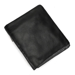 Close-up of black genuine leather wallet showing fine texture and bifold design