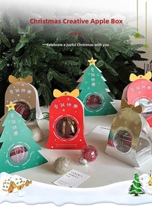 Detailed view of festive Christmas gift boxes with window cutout and star topper