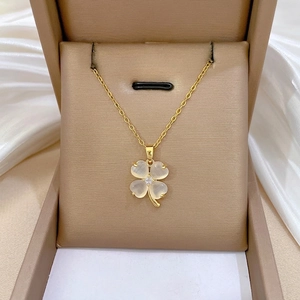 Elegant gold titanium necklace with clover cat eye stone pendant and sparkling crystal