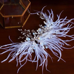 Exquisite bridal headband with white feathers, shimmering crystals and opal beads decoration