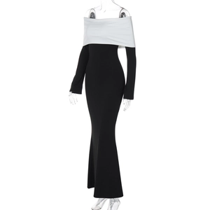 Detail of off-shoulder black and white bodycon dress with elegant fishtail hemline