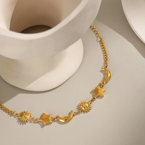 18K gold plated stainless steel sun moon star celestial bracelet on white art prop
