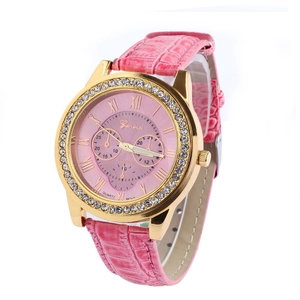 Geneva women's gold quartz watch with pink leather strap and crystal bezel on white background