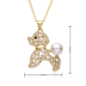 Macro detail of gold-plated poodle pendant with white zircons, pearl tail and dimensions