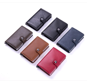 Detailed view of RFID blocking pop-up card wallets in assorted leather textures and colors