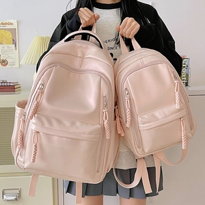 Minimalist pink PU leather backpack for women in large and small sizes with woven zipper pull