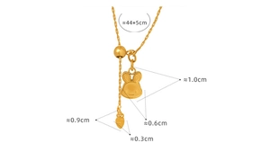 Detailed view of gold rabbit and carrot pendant necklace with size measurements