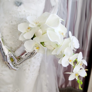 Cascade bridal bouquet with white calla lilies and orchids for romantic weddings