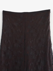 Detail of elegant black lace and mesh paneling on the straight leg trousers