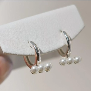 Elegant 925 sterling silver hoop earrings featuring three small white pearls for women