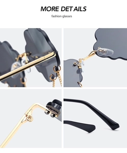 Detailed close-up of cloud-shaped rimless sunglasses with gold metal frame and hardware