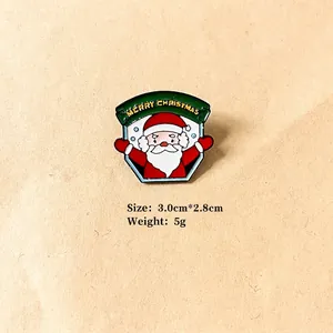 Detail view of enamel Santa Claus brooch with Merry Christmas text and size 3x2.8cm