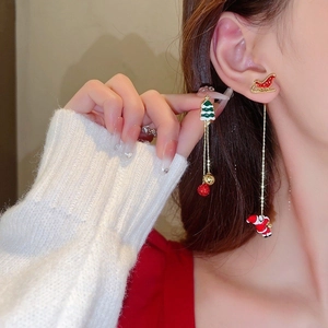 Asymmetric Christmas tassel earrings with festive enamel charms and long gold chains