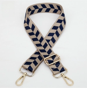 Detail of No.164 jacquard strap with gold-tone hardware and navy beige chevron pattern